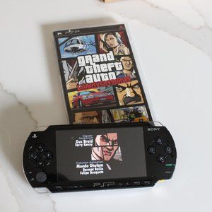 PSP with case, accessories, and game (Grand Theft Auto : Liberty City